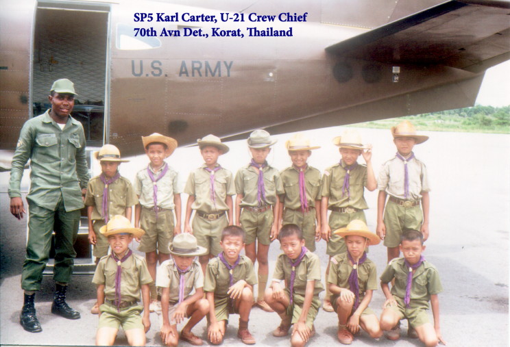 SP5 Karl Carter, U-21 Crew Chief, 70th Avn Det, Korat, Thailand, with Thai Boy Scouts SP5 Karl Carter, U-21 Crew Chief, 70th Avn Det, Korat, Thailand, with Thai Boy Scouts